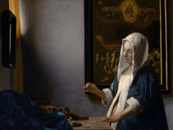Woman Holding a Balance