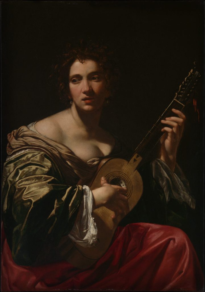 woman-playing-a-guitar