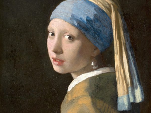 Head of a girl in a blue and yellow turban turning over her shoulder