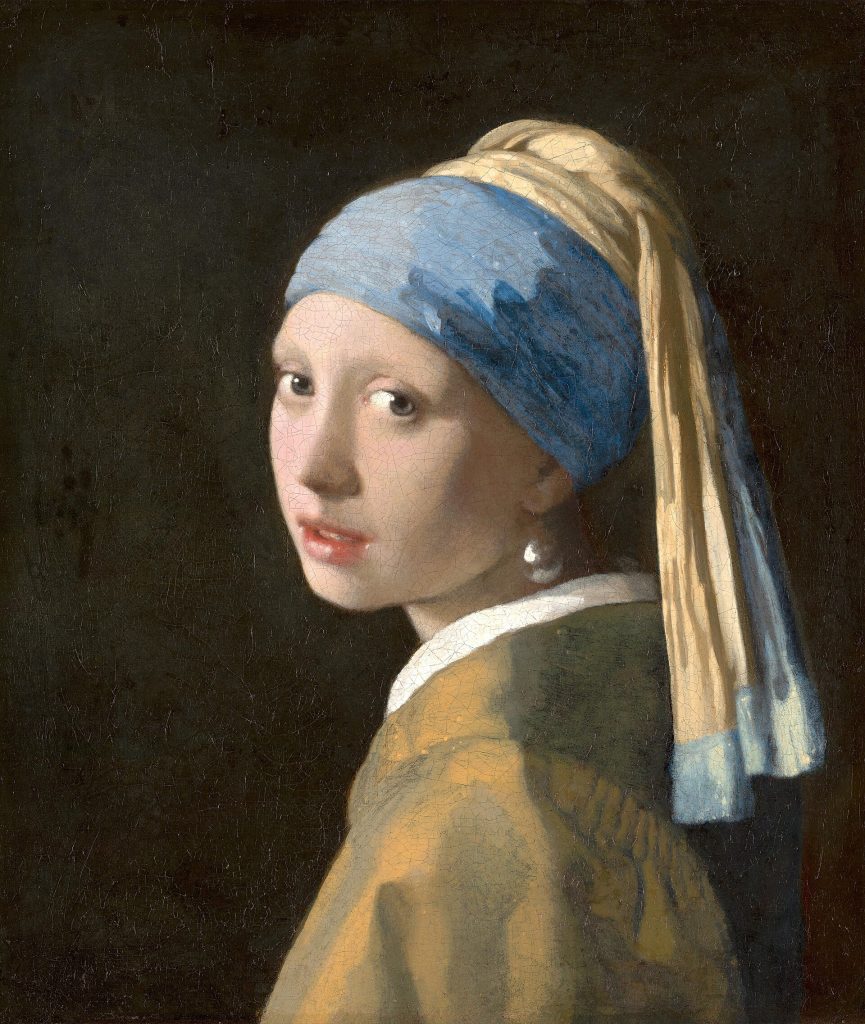Head of a girl in a blue and yellow turban turning over her shoulder