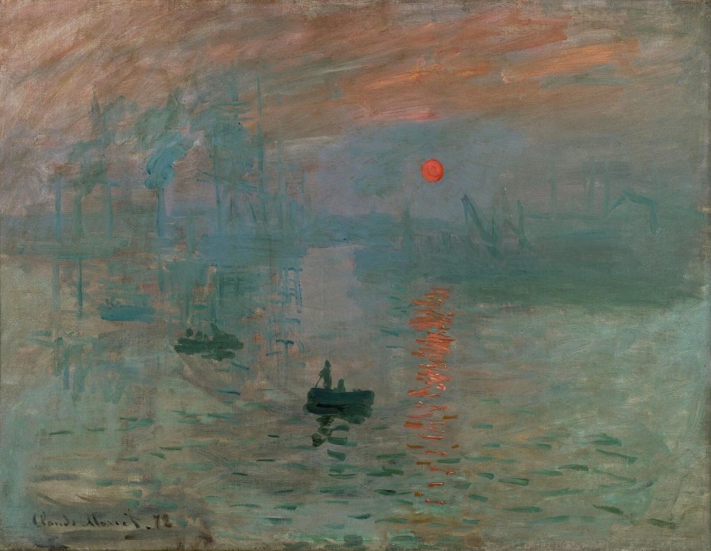 Hazy orange sun over misty harbour water with small boats